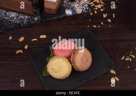 Table with cakes ans coffee cup Stock Photo