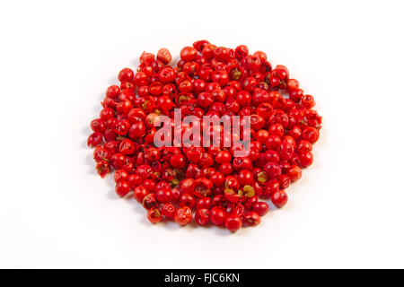 Pile of red peppercorns, isolated on white Stock Photo