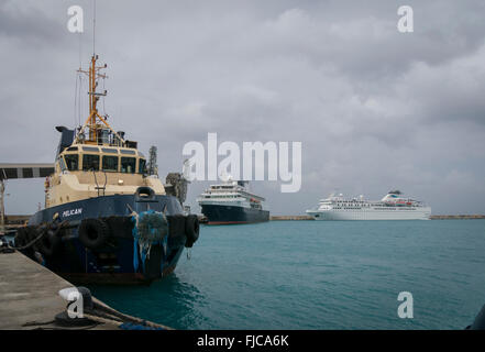 Pilot boat and cruise ships in the terminal at Bridgetown, Barbados Stock Photo