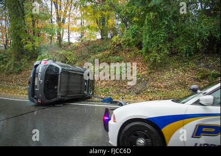 Overturned Car With Police Car At Accident Scene, Philadelphia, USA Stock Photo
