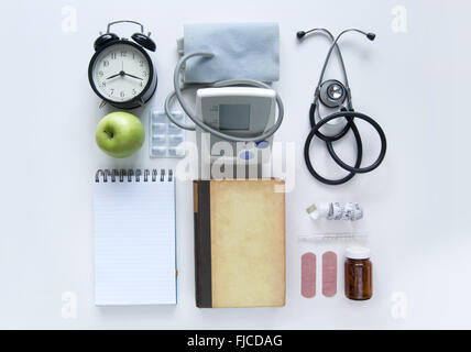 Medical objects laid out on a white table Stock Photo
