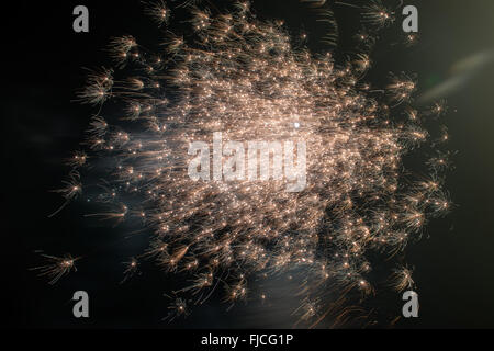 Fireworks exploding at night Stock Photo