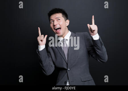 Excited Chinese businessman having a good idea Stock Photo