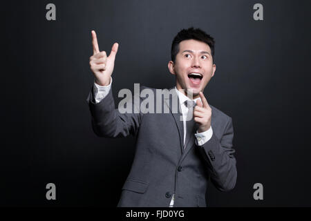 Excited Chinese businessman having a good idea Stock Photo