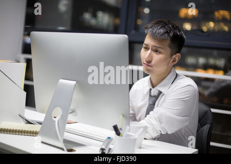 Excited young Chinese man Stock Photo