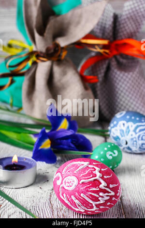Painted Easter eggs,a iris flower and pouches with ears Stock Photo