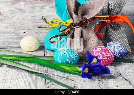 Painted Easter eggs,a iris flower and pouches with ears Stock Photo