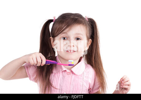 child girl brushing teeth isolated on white background Stock Photo