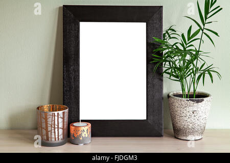 Image of frame mockup scene with plant and candle holders. Stock Photo