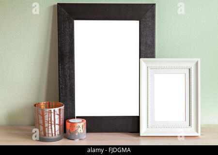 Image of mock up scene with two frames and decorative candle holders. Stock Photo
