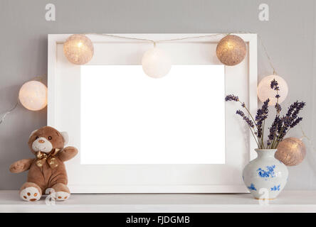 Image of mockup scene with white frame and decorative items. Stock Photo