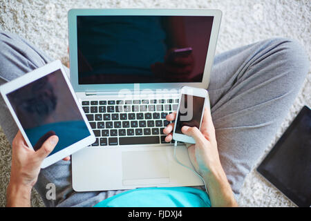 Close-up of male hands using his gadgets Stock Photo