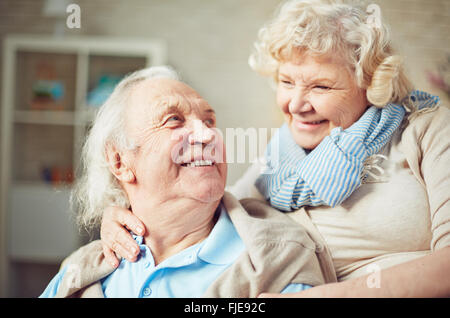 Happy senior couple embracing and laughing Stock Photo