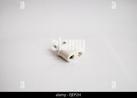 Two pin UK mains adapter for use with an electric shaver in Europe Stock Photo
