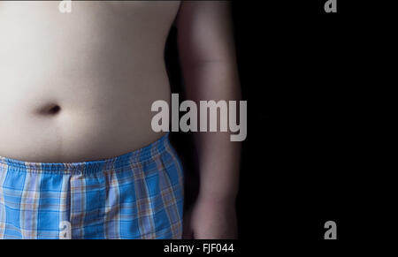 fat boy isolated on black background. Stock Photo