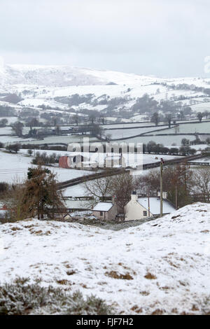 Storm Jake leaves a covering of snow over the rural village of Rhes-Cae and Halkyn Mountain towars the Cwlydian Range or Clwydian Hills in the distance, Flintshire, Wales, UK Stock Photo