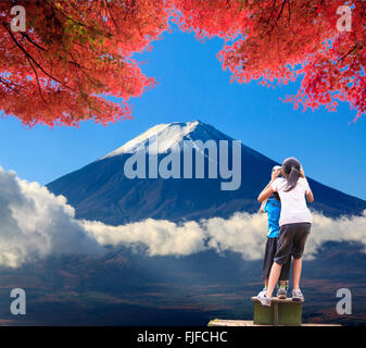 girl seeing landscape through telescope Stock Photo - Alamy