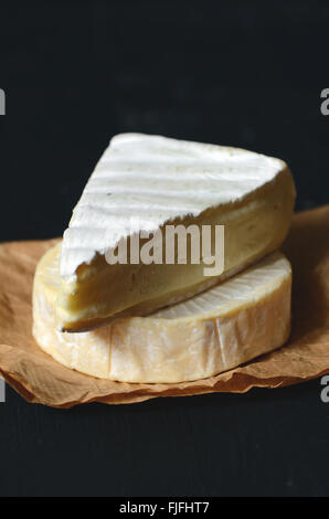 A Slice of Fresh Brie cheese, close up shot Stock Photo