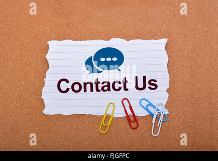 Contact Us with Speech Icons on Paper. Stock Photo