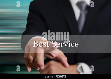 Businessman hand touching Best Service on virtual screen as service concept. Stock Photo