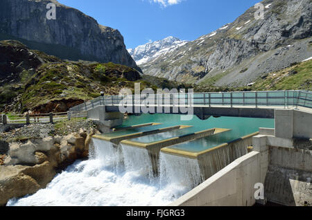 Artificial waterfall of the mountain dam in the French Pyrenees Stock Photo