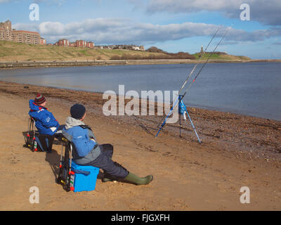 Newcastle Upon Tyne, Wednesday 2nd March 2016, UK Weather. A cold day on the banks of the river Tyne, near Tynemouth as fishermen wait for bites on their lines. These sea anglers are fishing in the river Tyne's estuary away from the tidal currents of the rivers main course for flat fish and whiting. Which the estuary is also a transition zone between the river and the estuary ecosystem for these types of fish. Credit:  james walsh/Alamy Live News Stock Photo