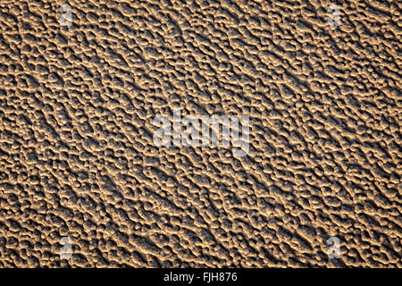 Patterns in beach sand caused by wind and rain. Stock Photo