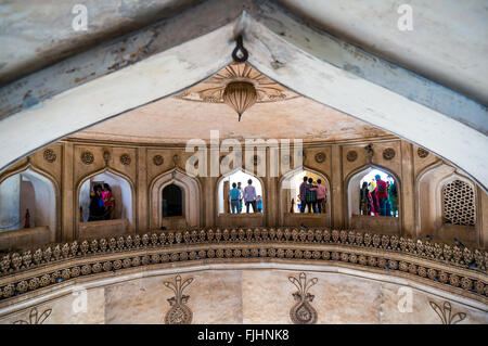 Hyderabad, Telangana, India, 28th Feb 2016: Interior arches of the second floor in the charminar Hyderabad showing people visiting Stock Photo