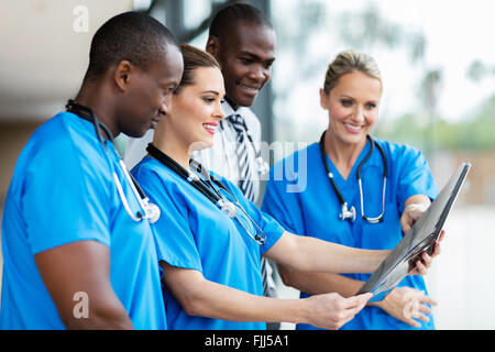 group of medical workers looking at patient's x-ray Stock Photo