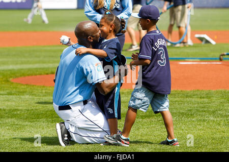 Port Charlotte, Florida, USA. 2nd Mar, 2016. WILL VRAGOVIC | Times.Petty Officer Patrick Jackson, US Navy Seabees, hugs his children, Isaih, 7, and Fallon, 5, after surprising them by catching the ceremonial first pitch before the exhibition opener between the Tampa Bay Rays and the Washington Nationals at Charlotte Sports Park in Port Charlotte, Fla. on Wednesday, March 2, 2016. Jackson's children did not know he was home from his deployment. © Will Vragovic/Tampa Bay Times/ZUMA Wire/Alamy Live News Stock Photo