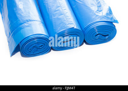 Roll of blue plastic garbage bags isolated on white Stock Photo