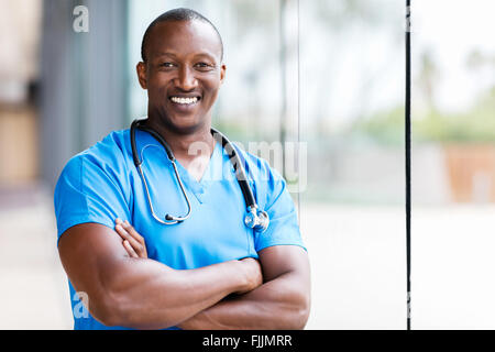 happy male African medical surgeon looking at the camera Stock Photo