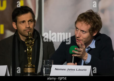 Budapest, Hungary. 2nd Mar, 2016. Hungarian film director Laszlo Nemes (R) and actor Geza Rohrig attend a press conference in Budapest, Hungary, March 2, 2016. Hungarian film 'Son of Saul' directed by Laszlo Nemes Jeles won the Oscar Award for Best Foreign Language Film at the 88th Academy Awards Ceremony. © Attila Volgyi/Xinhua/Alamy Live News Stock Photo