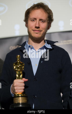 Budapest, Hungary. 2nd Mar, 2016. Hungarian film director Laszlo Nemes holds his Oscar statuette at a press conference in Budapest, Hungary, March 2, 2016. Hungarian film 'Son of Saul' directed by Laszlo Nemes Jeles won the Oscar Award for Best Foreign Language Film at the 88th Academy Awards Ceremony. © Attila Volgyi/Xinhua/Alamy Live News Stock Photo