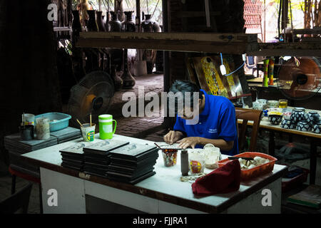 Victims of Agent Orange working at the Nam Quoc Lacquerware Factory in the suburbs of Ho Chi Minh City Stock Photo