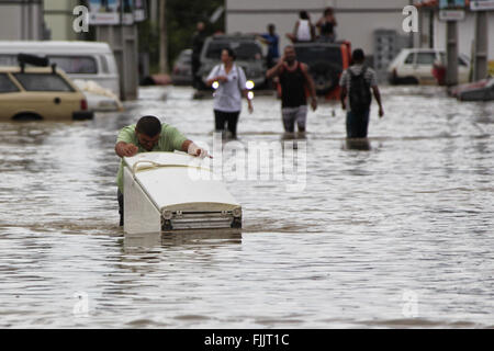 Marica, Brazil. 2nd Mar, 2016. Residents walk through flood in Itaipuacu district, Marica city, Rio de Janeiro state, Brazil, on March 2, 2016. Residents in different parts of Itaipuacu district remain stranded after the 24-hour heavy rains. Credit:  Paulo Campos/AGENCIA ESTADO (jg/Xinhua/Alamy Live News Stock Photo