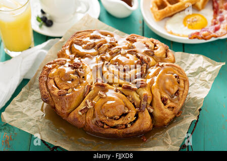 Sticky pecan buns on breakfast table Stock Photo