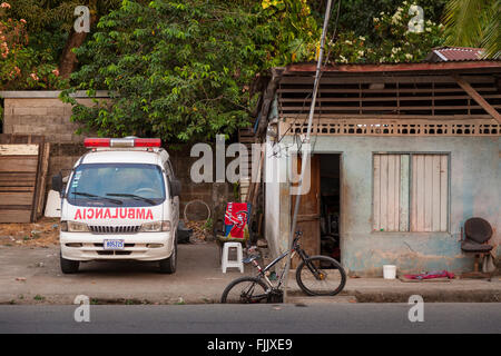 An ambulance parked in the driveway of a small home in Quepos, Puntarenas Province, Costa Rica. Stock Photo