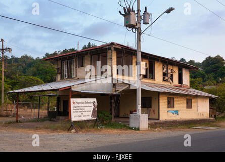 An abandoned building sits empty near the new Marina in Quepos, Puntarenas Province, Costa Rica. Stock Photo