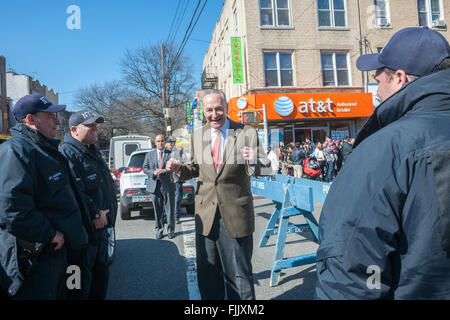 NY Senator Charles Schumer greets police officers Eighth Avenue in the Sunset Park neighborhood in Brooklyn in New York on Sunday, February 28, 2016 during the Lantern Festival street fair. Sunset Park has become Brooklyn's Chinatown as Chinese and other Asian groups have moved there and businesses have sprouted up to cater to them. (© Richard B. Levine) Stock Photo