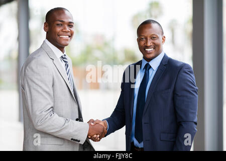 portrait of happy African American businesspeople handshaking Stock Photo