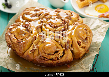 Sticky pecan buns on breakfast table Stock Photo