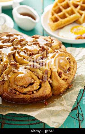 Sticky pecan buns on breakfast table Stock Photo