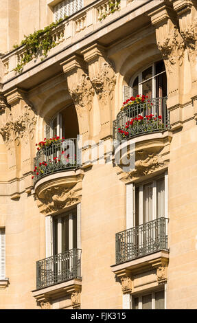 Detail of typical Hausmann-era apartment building in Paris, France. Facades in this style are common throughout the city. Stock Photo