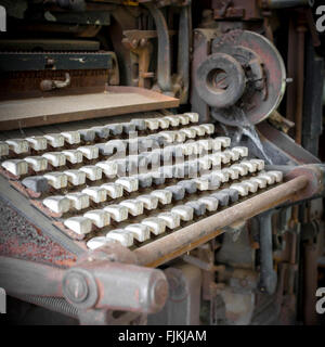 Old industrial machine with vintage keyboard. Extreme close-up and selective focus. Stock Photo