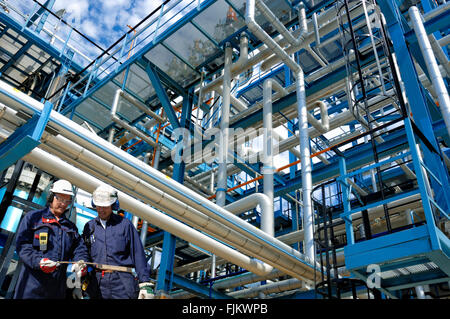 Oil And Gas Workers Inside Oil Refinery Stock Photo Alamy