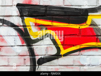 Abstract colorful graffiti fragment over old urban brick wall Stock Photo