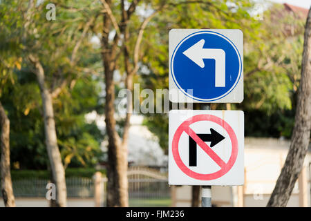 Turn left, and no right turn traffic sign post with clipping path Stock Photo