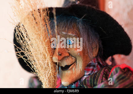 Portrait of a witch doll with a hat and broom Stock Photo