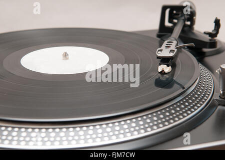 Old style vinyl record spinning on a turntable Stock Photo